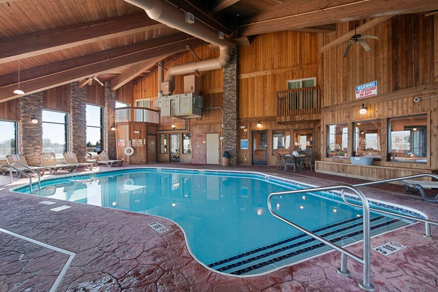 Indoor pool with vaulted timber-frame ceiling