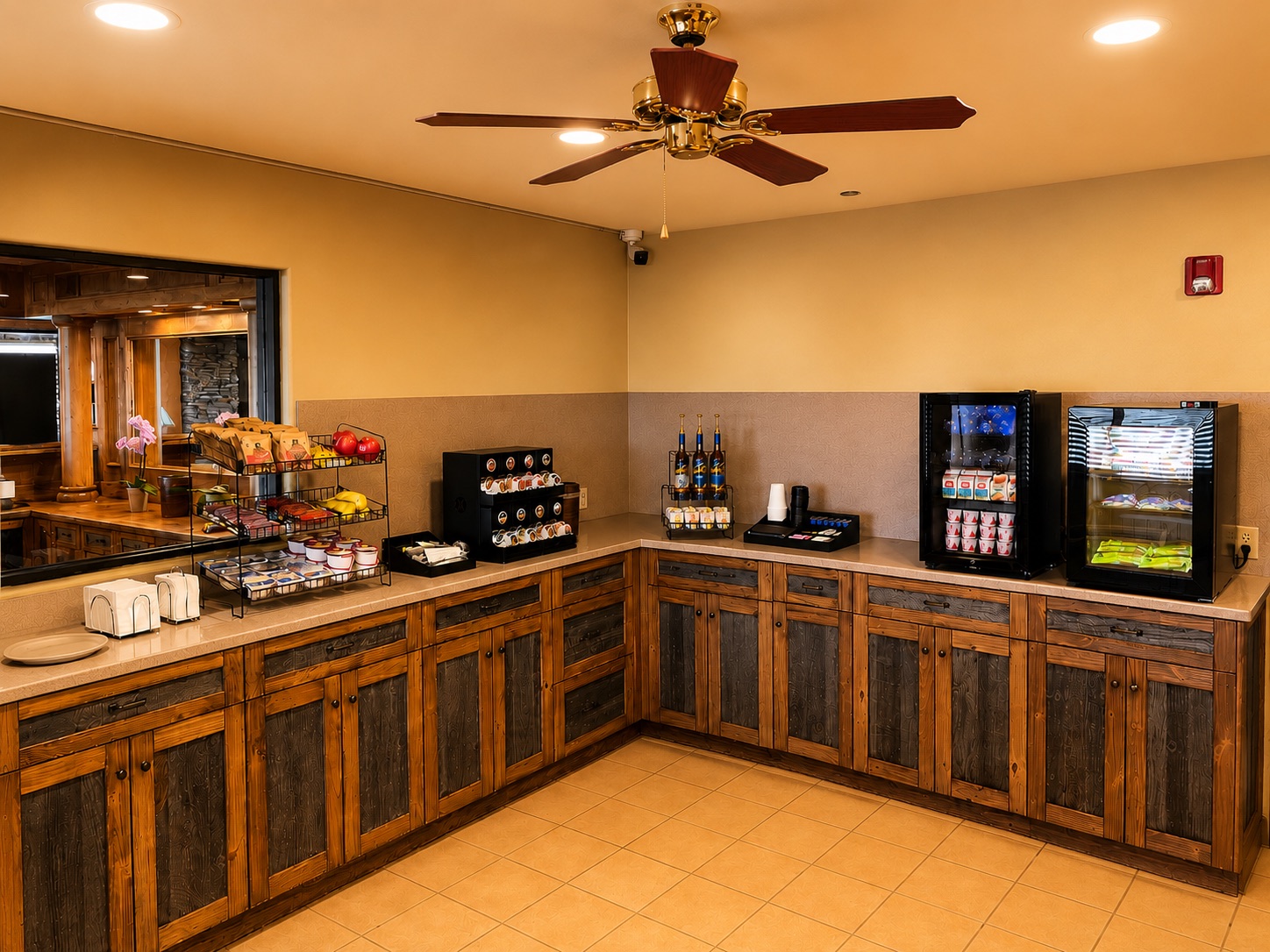 Continental breakfast and coffee bar with pastries, fruit, and beverage coolers